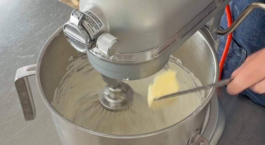 softened butter beaten two tablespoons at a time into the meringue
