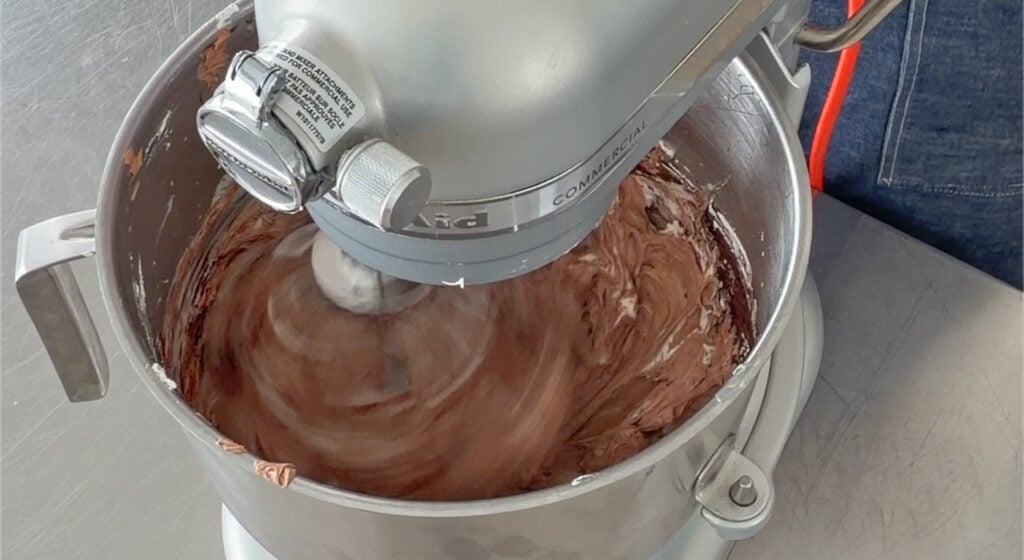 melted cooled dark chocolate poured in, turning it glossy chocolate
